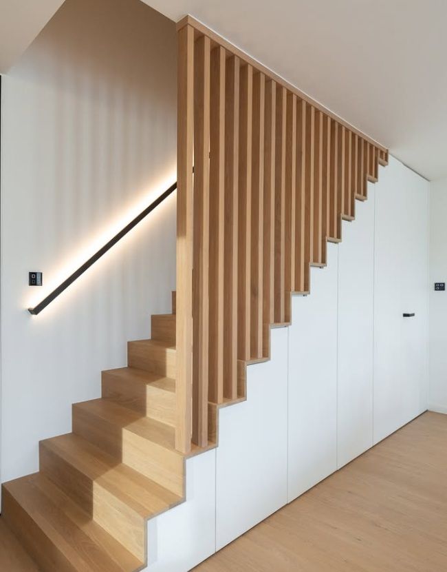 Staircase with built-in cabinetry